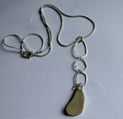 Light Seafoam seaglass exposed bezel pendant with organic shaped and hammered sterling silver links