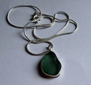 Bright green seaglass exposed bezel pendant with cutout sterling silver